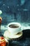 Close-up of coffee cup with roasted coffee beans on black background. Close-up of a cup of coffee. Cup of coffe. Delicious coffe c