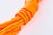 Close-up on a coil of orange nylon cord