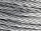 Close up of coiled metal cable industrial background