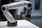 close-up of collaborative robot's arm, with its delicate fingers gripping a component