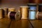 Close Up of a Collection of Antique Wooden Spools of Thread Reflected in Wooden Planks