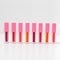 Close-up of a collection of colorful lipstick samples on a white background