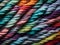 close up colored threads on a dark background