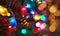 Close-up of colorful bokeh lights illuminating, festive night abstract background