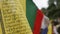 Close-up of Colorful Buddhist Tibetan prayer flags at mountains wave in the breeze blowing.