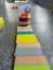 Close-up of colorful children\\\'s toys scattered on the floor.