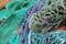 Close-up on colorful fishing nets in the Portree fishing harbor, Isle of Skye, Highlands, Scotland, UK