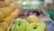 Close-up of colorful fruit stand with apples and oranges