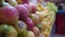 Close-up of a colorful fruit stand with fresh mangoes