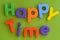 Close up of colorful Happy Time words in plastic l