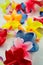 Close-up colorful Hawaiian lei with bright flowers on white background