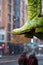 Close up of colorful heel boots dangling storefront in city