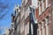 Close-up on colorful heritage buildings with gable rooftops, located along Brouwersgracht Canal in Amsterdam, Netherlands