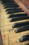 Close-up of the colorful keys of an old piano