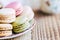 Close up on colorful macarons in a cup