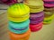 Close up of colorful macarons on wooden background