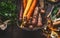 Close up of colorful organic root vegetables in harvest basket on dark background, top view. Healthy and clean food and eating