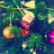 Close up of colorful ornaments on Christmas tree. Square framing, instagram style toning
