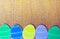 Close-up of colorful paper eggs silhouette frames against canvas background