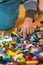 Close up of colorful plastic bricks on the floor. Early learning. Children\'s plastic constructor on the floor. Children\'s hands