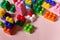 Close up of colorful plastic bricks at the table. fun and building out of bright constructor bricks. Early learning