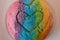 Close up of a Colorful Rainbow Concha Mexican Pastry with a Heart Shape for LGBT Valentines.