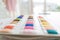 Close-up of colorful sample fabrics catalog palette rack color. Sample materials for dressmakers working and designing new fashion