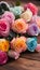 close-up of colourful pastel roses on a wooden table