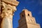 Close-up on a column in the courtyard of  the Great Mosque of Kairouan with the minaret in the background