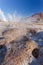 Close up of of colums of hot white smoke. Taken during the sunrise at Geysers of Tatio at Los Flamencos national reserve in
