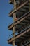 Close up of commercial office building under construction with construction workers ,steel beams with weight of steel beams sprypa