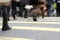 Close Up Of Commuters Feet Crossing Busy Street