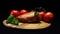 Close-up composition of grilled chicken, tomatoes and greens lying on a wooden board on the black background. Frame