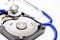 Close up computer hard disk and stethoscope data health check, data security concept on white background