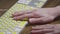 Close-up of a computer keyboard with braille. A blind girl is typing words on the buttons with her hands. Technological