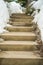 Close up of concrete outdoor steps on a slope covered with fresh snow in winter