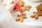 Close up of confectioner hand decorating a gingerman