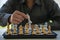 Close-up of confident businessman playing chess game to analyze development new strategic plan Leadership and Teamwork Ideas for B