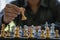 Close-up of confident businessman playing chess game to analyze development new strategic plan Leadership and Teamwork Ideas for B