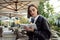 Close-up confident portrait of concentrated attractive young business woman, copywriter, journalist, writing on white notepad