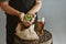 Close up of confident young man brewer with self crafted beer