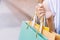 Close up of consumerism young woman holding hand many shopping bag in fashion