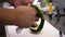 Close up of cook hands peeling an avocado