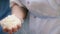 Close-up of cook kneading dough for easter cakes. Stock footage. Cook crumples piece of yeast dough with raisins and