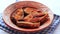 close up of cooked ilsha fish on plate on table