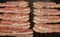 Close up cooking bacon slices on electric grill