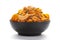 Close up of corn flex mixture Indian namkeen snacks on a ceramic black bowl