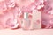 Close-up of cosmetic items on pink background