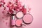 Close-up of cosmetic items on pink background