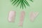 Close Up Cosmetic Massage Pink Jade Gua Sha Scrapers for Facial and Body Skin Care Spa and Beauty Concept Green Background Flat